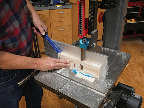 Separating bow tie shapes from lumber with band saw