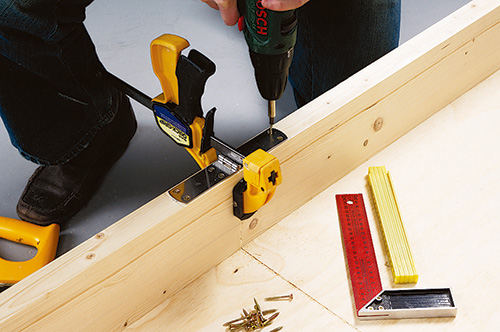 Clamping convertible coffee table bed halves together to install hinges