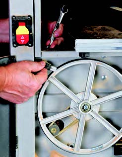 Most benchtop band saws in this test, including the 10" Craftsman 21400, have an adjustable brush that prevents sawdust buildup on the lower wheel’s tire.