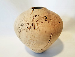 Turned vase with holes