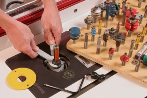 DRAWERS 2 It doesn't take hi tech to tame shop chaos. I store my surplus of router bits on a board full of holes. Simple, cheap and I know right where they are.