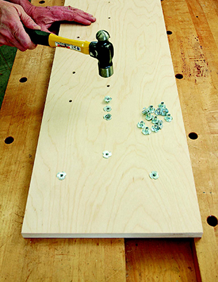 Installing threaded fastening nuts to base of dovetailing jig