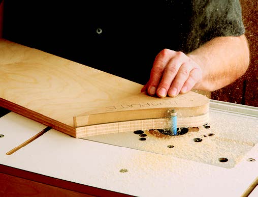 Using template as guide to smooth ends of sanding cart panel