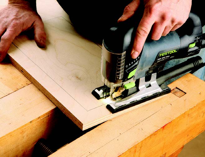 Cutting out sanding cart drawer with jigsaw