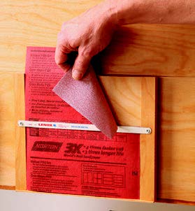 Sandpaper cutter attached to sanding cart