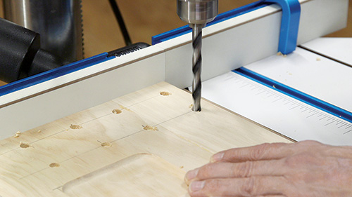 Drilling out drill bit storage holes