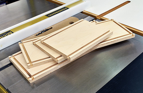 Five cut panels for making drill press cabinet