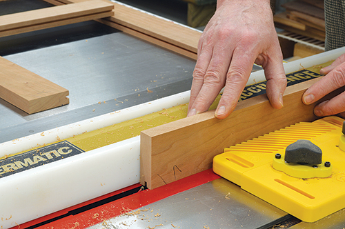 Cut the 1/4”-deep grooves for the frame-and-panel door on the table saw.