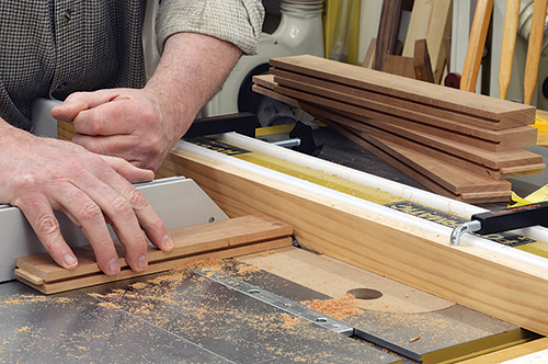 With all the frame grooves cut, create tongues on the ends of the top and bottom rails, as well as on the vertical center stile.