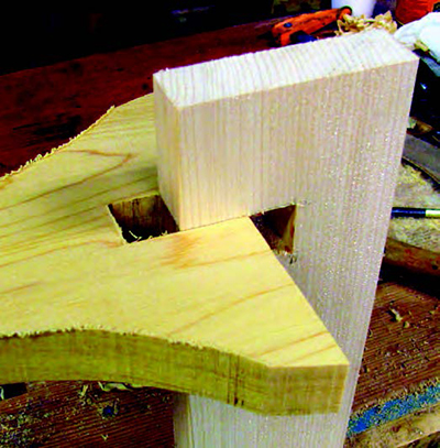 Test fitting bench stretcher onto leg blank