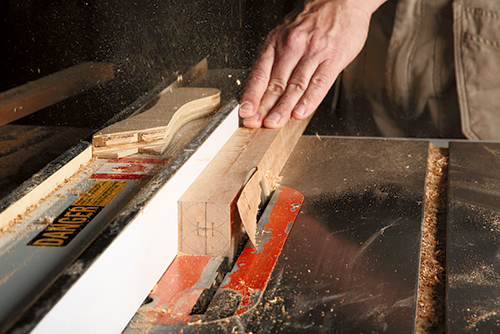 Cutting waste from floor lamp body with table saw
