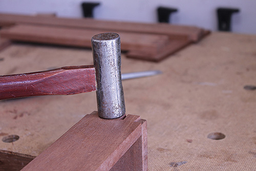 Hammering tray framework joinery together to check fit