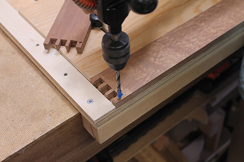 Drilling hole in tray frame for stopped rabbet