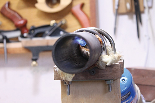 Heating pipe for wood bending with a torch