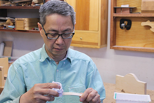 Wiping bent pipe down with water to prevent burn marks