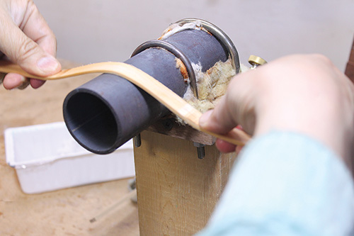 Running wood over bending jig a second time to create tray handles