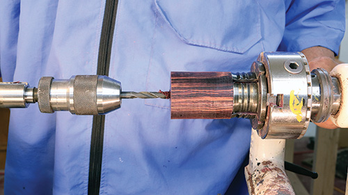 Drilling into spin top container base