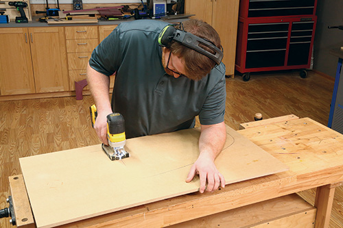 Cutting out second shelf template with jigsaw