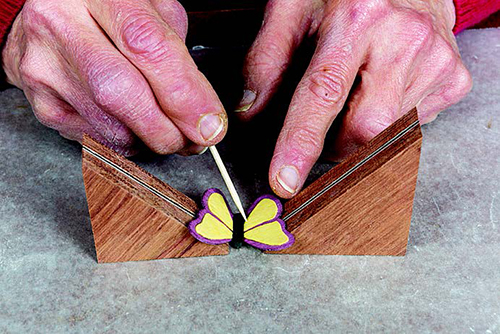 To be sure your support blocks are at the correct angle, do a dry fit before gluing on the wings. Use a toothpick to stabilize the body as you glue.