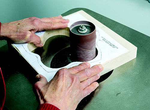 The box interior is easy to sand with an appropriately sized spindle. Work one lobe at a time until all blade and burn marks are gone.