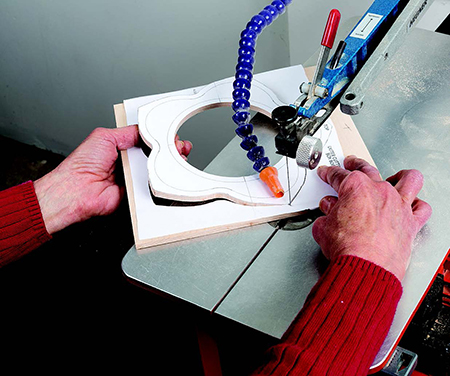 For a sleeker look, the author used a box top with a small, round lid. The center hole of the box top accommodates the lid liner, which secures the decorated lid.