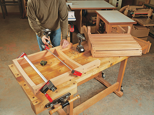Assembling folding adirondack chair framework