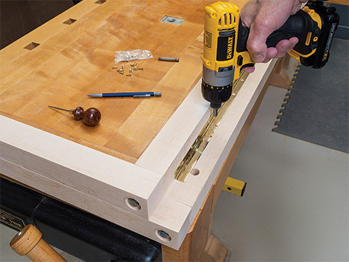 Installing hinge between folding bike rack segments