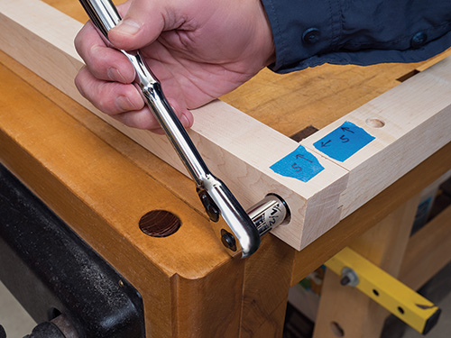 Attaching folding bolt to bike rack rail