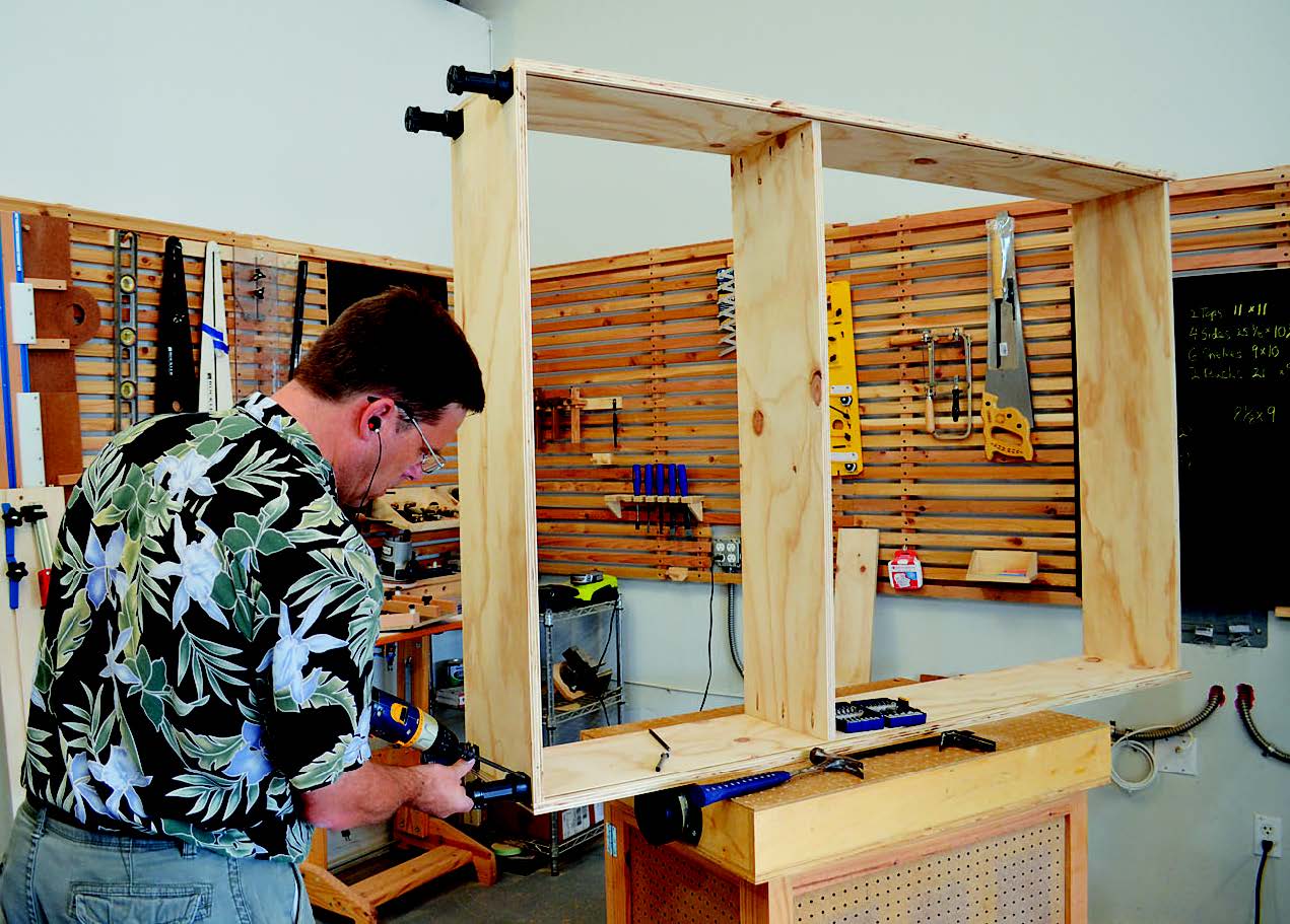 Adding support legs for base of folding workstation