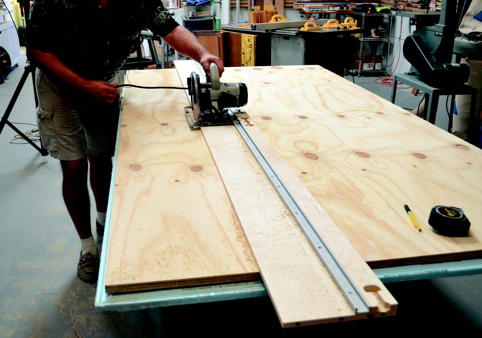 Using track saw to cut panels for folding workstation