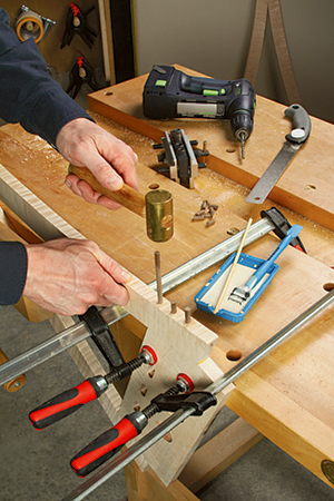 Hammering decorative dowels into mirror leg rail