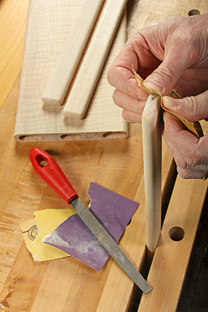 They started out as three long “sticks” (see inset), rounded over on their edges and ends, then cut to length. Spread glue in the mortises, and press them into place with clamp pressure instead of hammer blows.
