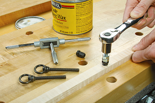 Threaded inserts are much easier to install if you first tap their insertion holes for standard threads, then screw them in using a machine bolt and doubled-up stop nuts. A little wax on the wood threads helps, too.