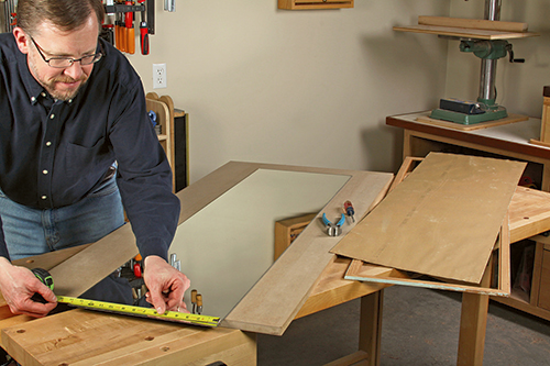 Measuring backing panel for glass mirror