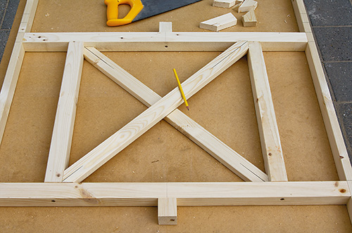 Placing cut portable gazebo project pieces and marking joint locations