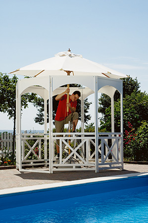 Placing umbrella in portable gazebo project through table