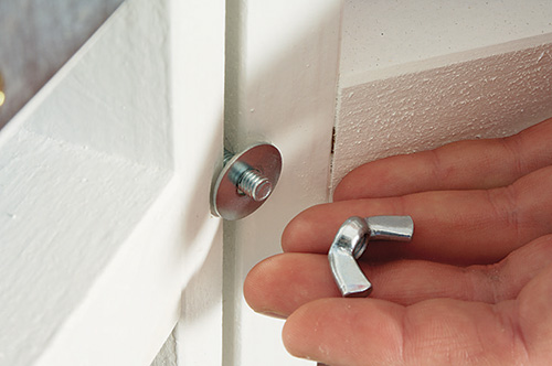 Securing final gazebo and umbrella assembly with bolt and wingnut