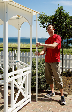Stretching umbrella material over sides of portable gazebo walls