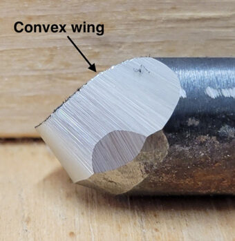 Convex wing sharpened on a turning gouge