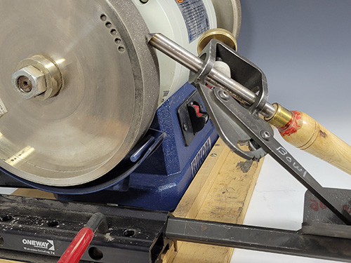 Sharpening a rolled over wing on a grinder