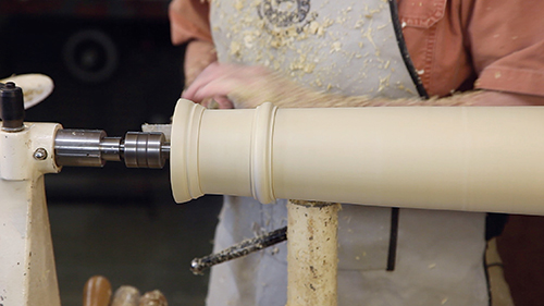 Grecian column blank mounted on a lathe
