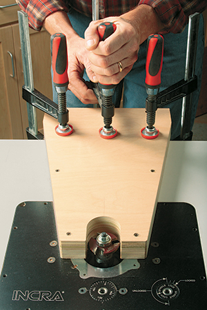 Setting up router bit to make cuts on center bed panel