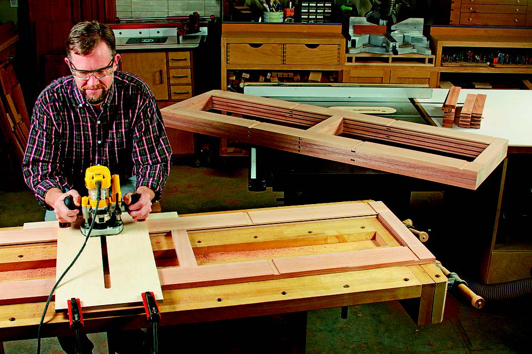 Shallow dadoes running across the web frame front and back pieces will help to register the vertical drawer dividers and upper drawer supports. A longer slotted jig and mortising bit make this task accurate and quick.