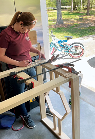 Clamping legs to tall table support base