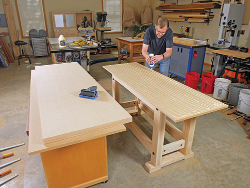 Preparing pieces of MDF for gluing together as tabletop