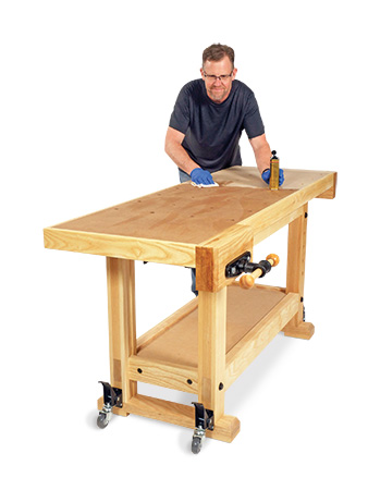 Wiping Danish oil finish on workbench tabletop