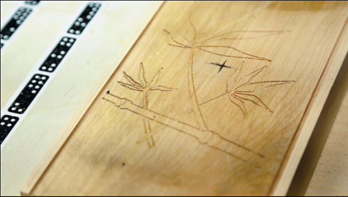 Bamboo carving on the back of the spindle bench