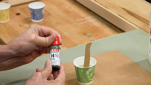 Adding green Mixol pigment to epoxy mixture