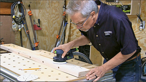 Sanding excess epoxy off inlay