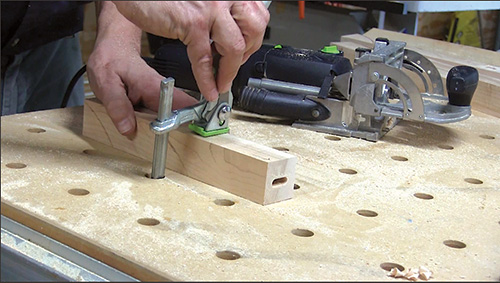 Hole cut for biscuit installation on a spindle blank